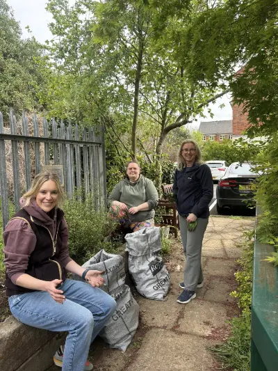 Image depicting three members of staff gardening at Sensory Matters' premises